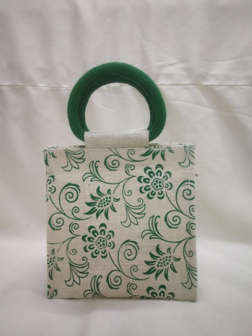 white jute bag with green color allover print